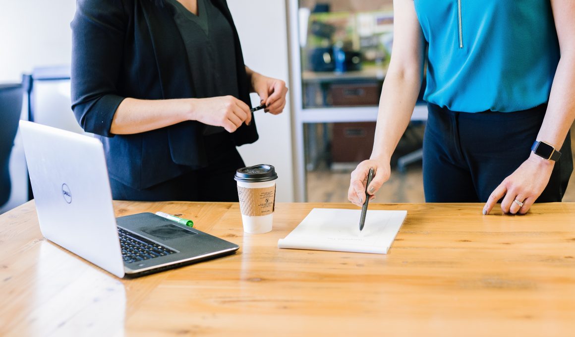 a manager is delegating tasks to staff
